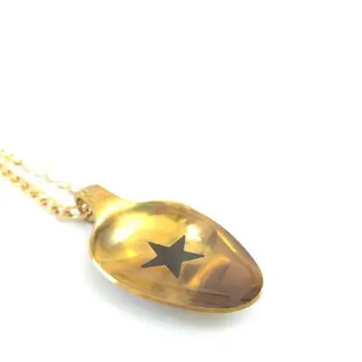 Unique golden teaspoon pendant with a black star and a resin coat,  vintage style.